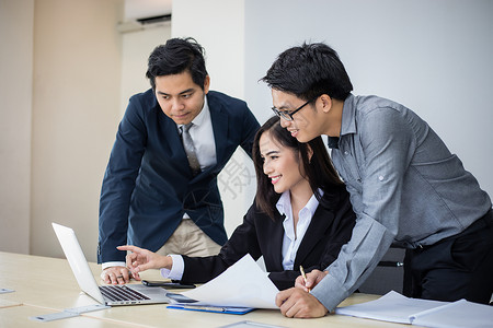 Professional finance team discussing crypto trading strategies in an office, showcasing transparency and trust for PCMX users.